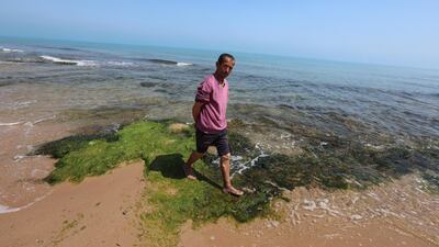 A man walks at the Marsa beach, in Tunis, Tunisia. EPA