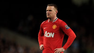 Wayne Rooney looks dejected in the 2011-12 season, when United were runners-up with 89 points. Getty