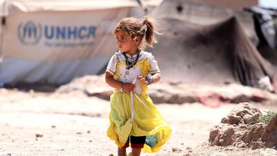 An Afghan girl, who was displaced internally due to conflict and disaster, walks at a temporary shelter provided by the United Nations High Commissioner for Refugees (UNHCR) on the outskirts of Herat, Afghanistan. EPA