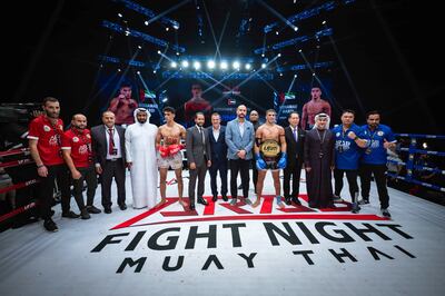 Mohammed Mardi poses with the title in the ring alongside his team and tournament officials. Photo: UAEMKFED
