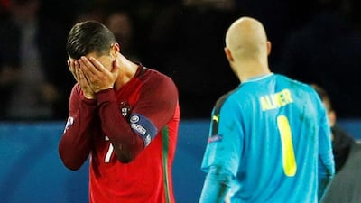 Portugal's Cristiano Ronaldo, left, reacts after missing a penalty against Austria during Euro 2016 match. REUTERS/John Sibley