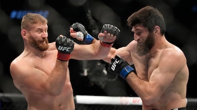 Jan Blachowicz, left, fights Magomed Ankalaev during a UFC 282 mixed martial arts light heavyweight title bout Saturday, Dec. 10, 2022, in Las Vegas. (AP Photo / John Locher)