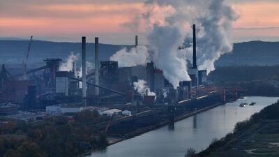 Emissions rise from a steel mill in Salzgitter, Germany. Demands are rising that countries participating in the upcoming Cop28 conference in Dubai agree on a road map for phasing out the use of fossil fuels. Getty Images