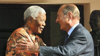 Jacques Chirac hugs former South African President Nelson Mandela after their meeting in Johannesburg on September 2, 2002. AFP