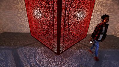 A visitor walks next to an exhibit titled All The Flowers Are For Me by Pakistani-American artist Anila Quayyum Agha at the India Art Fair in New Delhi, India, on February 3, 2017. Adnan Abidi / Reuters