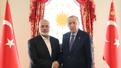 Turkish President Recep Tayyip Erdogan greets Hamas political leader Ismail Haniyeh before talks at the Dolmabahce Presidential Working Office in Istanbul, in April 2024. Turkish Presidency / EPA