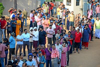 People queue up to vote during the second round of voting in the six-week long national election outside a polling booth in Bengaluru, India, Friday, April 26, 2024. (AP )