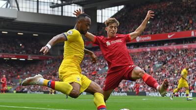 Crystal Palace forward Jordan Ayew vies with Liverpool defender Kostas Tsimikas. AFP