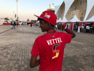 Yashish Manohar shows off the t-shirt of his favourite Formula One driver, Sebastian Vettel. Charles Capel / The National