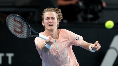 Sebastian Korda hits a forehand to Novak Djokovic. Getty