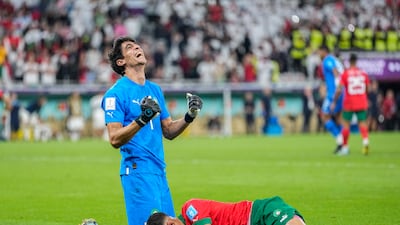 Morocco's goalkeeper Yassine Bounou, left, celebrates with Achraf Hakimi after guiding their team to the World Cup semi-final. AP