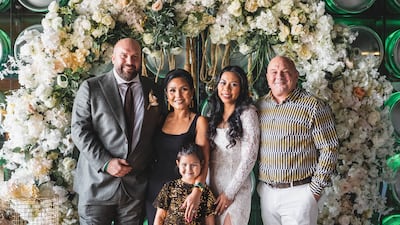 Graham Cassidy, left, and his wife Dearylen Secong, dressed in traditional wedding gear for their small reception at Home by McGettigan's. Photo: John Tuzon