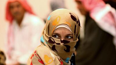 A Syrian refugee waits at a clinic at the Zaatari refugee camp near Mafraq, north of Amman, Jordan. Raad Adayleh / AP Photo