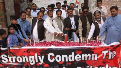 Pakistani citizens light candles at a vigil for the victims in Quetta. AP Photo
