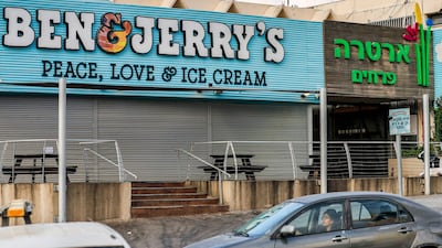 Motorists pass a closed Ben & Jerry's ice cream shop in the Israeli city of Yavne, about 30km south of Tel Aviv. AFP