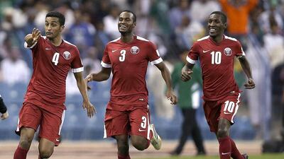 Qatar’s Almahdi Ali, left, celebrates after scoring a goal against Saudi Arabia during their Gulf Cup final in Riyadh. Fadi Al Assaad / Reuters