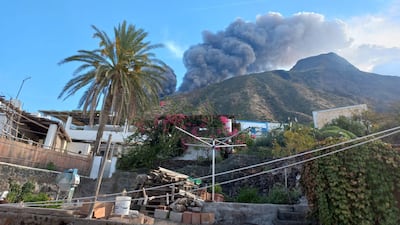 Dense smoke is visible from the hamlet of Ginostra as the Stromboli volcano erupts with lava flow that fell from the north crater to the coast. EPA