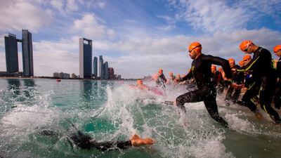 Open water swimmers take part on the Abu Dhabi Corniche.