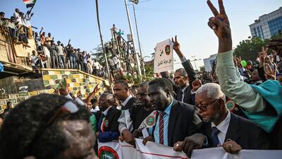 Sudanese judges, dressed in their robes, gather for a "million-strong" march outside the army headquarters in the capital Khartoum on April 25, 2019. AFP