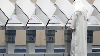 Voters check-in with election officials by presenting their Emirates ID and then use a private booth to electronically select their candidate of choice. More than 470 candidates are contesting just 20 seats