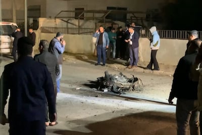 Jordanian security agents gather around the debris of a missile intercepted over Amman amid an Iranian drone and missile attack on Israel. AFP