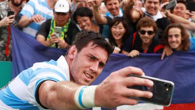Matias Alemanno of Argentina takes selfie photographs with fans after the Rugby World Cup 2019 Group C game between Argentina and Tonga at Hanazono Rugby Stadium in Higashiosaka, Osaka, Japan. Getty Images