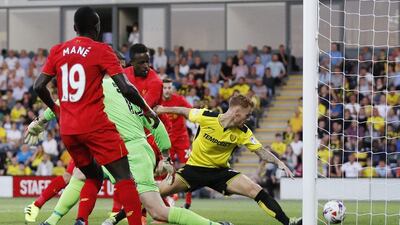 Liverpool’s Divock Origi scores their first goal. Darren Staples / Reuters