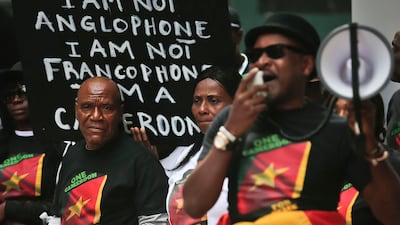 Language barrier: protestors calling for "national unity" outside hosting Cameroon's President Paul Biya New York hotel during the United Nations General Assembly, on September 22, 2017. Bebeto Matthews / AP
