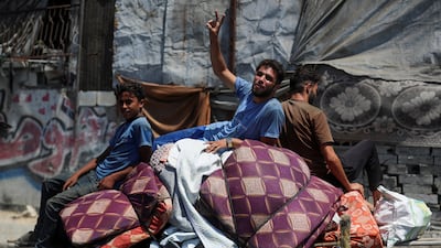 Displaced Palestinians travel on a cart loaded with their belongings in Gaza city. Reuters