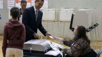 Barack Obama casts his vote in the US presidential election at the Beulah Shoesmith Elementary School in Chicago.