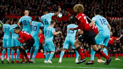 Manchester United's Juan Mata scores their first goal. Reuters
