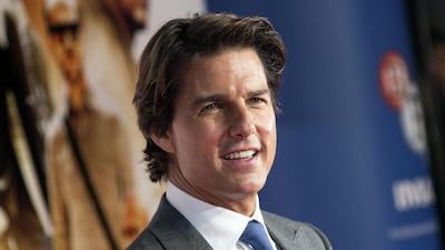 Tom Cruise poses for photographers as he arrives for the UK premiere of Mission: Impossible- Rogue Nation, at the BFI IMax in central London. AP