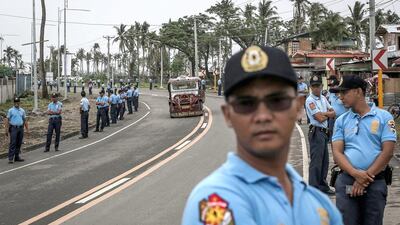 Police line a road in Tacloban on the Philippine island of Leyte, on January 14, as they rehearse security procedures ahead of Pope Francis' visit to the country. Chris McGrath/Getty Images