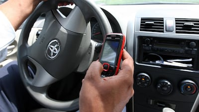 Motorist continue to use mobile phones while driving in the UAE despite various traffic awareness campaigns, fines and accidents on the roads. Pawan Singh / The National