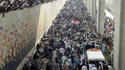 Pakistanis line the streets of Rawalpindi for the funeral of Mumtaz Qadri. Qadri was hanged on Monday for the assassination of a secular governor in 2011 over accusations of blasphemy. Sohail Shahzad / EPA