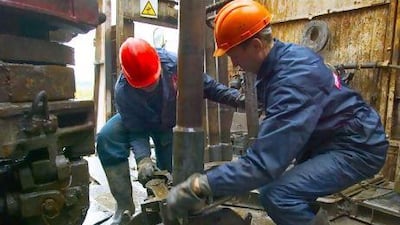 This year emerging economies will consume more oil than high-income countries. Above, workers drill for oil in Russia. Bloomberg News