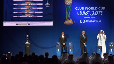 From left to right, retired Colombian footballer Ivan Cordoba, Head of Fifa tournaments Jaime Yarza watch as UAE footballer Abdulrahim Jumaa shows a group position in the official draw of the Fifa Club World Cup in Abu Dhabi. All photos Giuseppe Cacace / AFP Photo