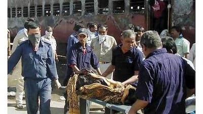 Security officials inspect the site of a suicide blast at a police station in Mingora, near the troubled Swat region.
