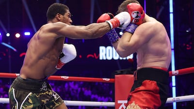 Anthony Joshua lands a right hand on Kristian Prenga. Getty Images