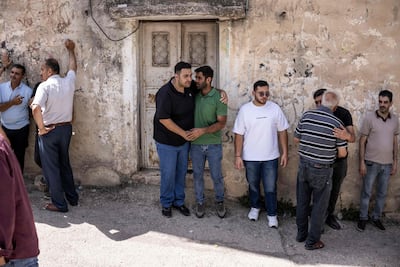 Palestinians offer condolences to bereaved relatives after the clash in the village of Tell. AFP