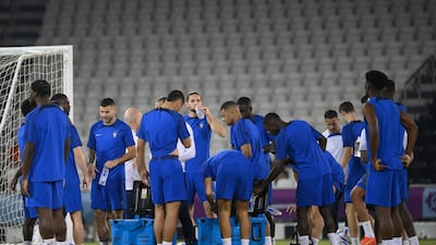 France players stop for a drinks break during a training session. AFP