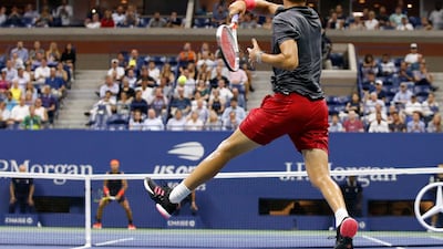 Thiem follows through on a return to Nadal. AP Photo