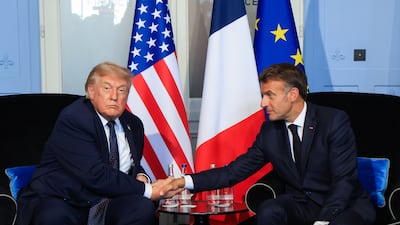 US President Donald Trump (L) shakes hands with French President Emmanuel Macron during a bilateral meeting on the sidelines of the G7 summit in Evian-les-Bains, central-eastern France, 15 June 2026. The 52nd G7 Summit takes place in Evian-les-Bains from 15 to 17 June 2026. EPA / LUDOVIC MARIN / POOL MAXPPP OUT