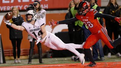 Colorado wide receiver Jay MacIntyre (14) reaches for an incomplete pass as Utah defensive back Javelin Guidry (28) defends during the second half during an NCAA college football game in Salt Lake City. Rick Bowmer / AP Photo