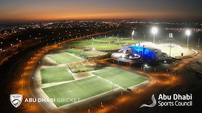 An after shot of the grass fields surrounding the main arena at Zayed Cricket Stadium.