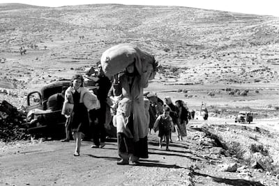 Arabs make their way towards Lebanon from villages in the Galilee in 1948. Corbis