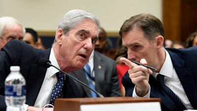 Former Special Counsel Robert Mueller, left, talks with his top aide in the investigation Aaron Zebley, right, during a House Judiciary Committee. AP