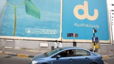 A du billboard in central Abu Dhabi. The company has taken a clear lead in new customer acquisitions.