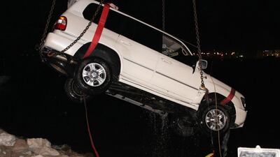 Ambulance and rescue teams at Ras Al Khaimah Police extracted the vehicle of an Arab man from the water at Al Muaairid beach. Courtesy RAK Police