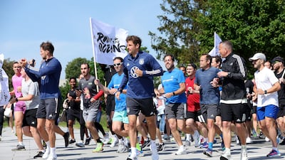 Thomas Muller and Leon Goretzka during the "Run for the Oceans" charity initiative in Germany on Tuesday. Getty